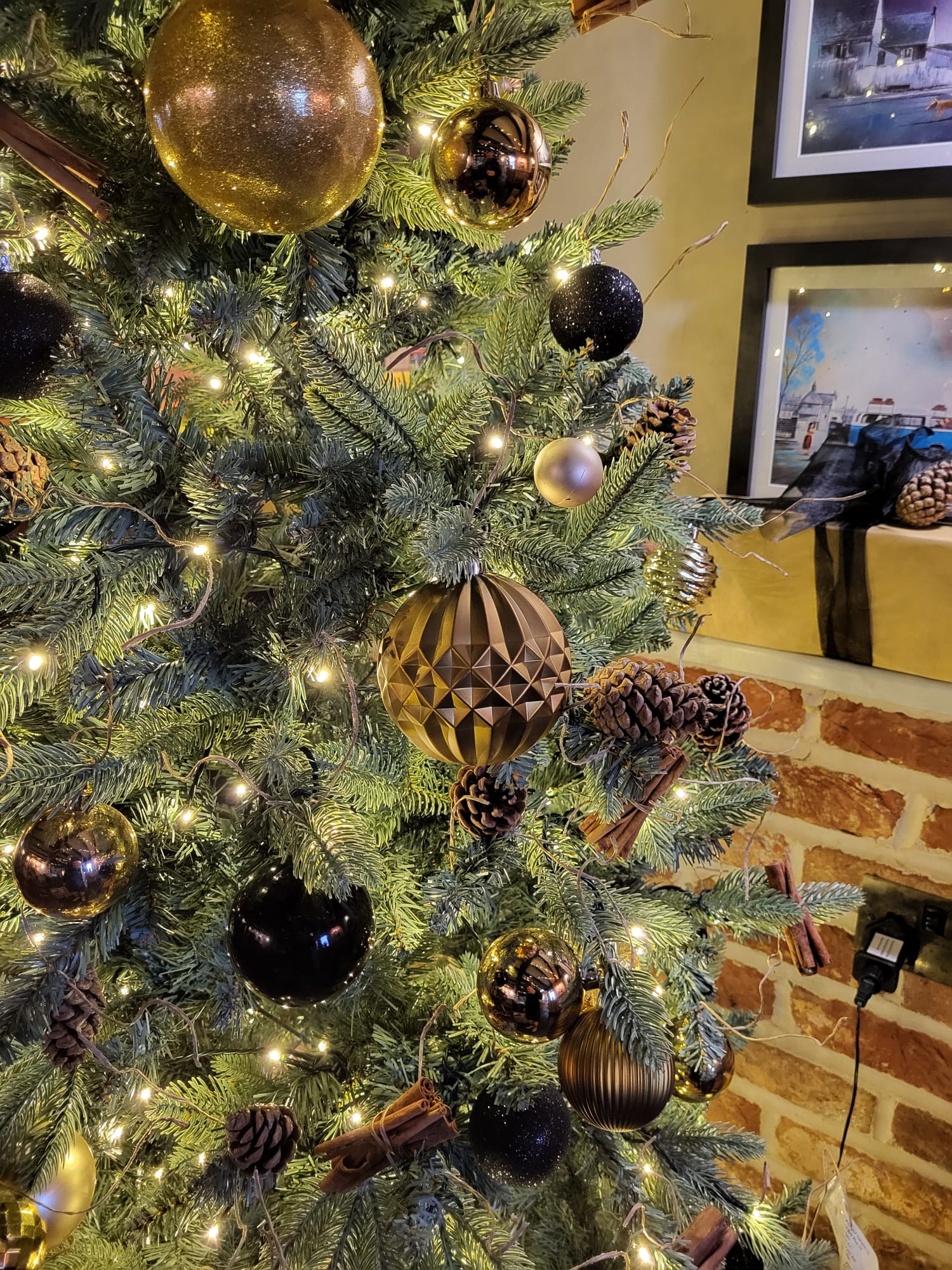 Christmas tree decorated in gold and black